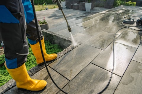 Stone patio area before and after professional cleaning