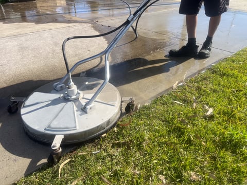 Professional driveway pressure washing removing grime and dirt